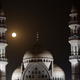 Moon rising over a mosque in the suburbs of Islamabad, Pakistan. Image: B.K. Bangash/AP